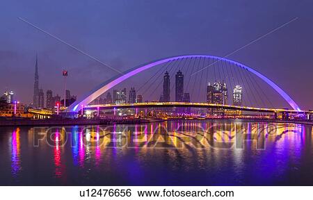 Pedestrian bridge across Dubai Creek, Water Canal Walk, UAE View Large Photo Image Stock Photograph - Pedestrian bridge across Dubai Creek, Water Canal Walk, UAE. Fotosearch
