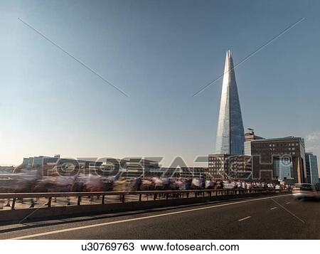 People walking along London Bridge, London, UK View Large Photo Image Stock Image - People walking along London Bridge, London, UK. Fotosearch