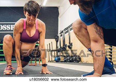 Personal trainer encouraging pregnant woman in gym View Large Photo Image Stock Image - Personal trainer encouraging pregnant woman in gym. Fotosearch