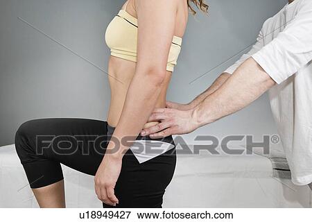 Physical therapist examining patient View Large Photo Image Stock Photo - Physical therapist examining patient. Fotosearch
