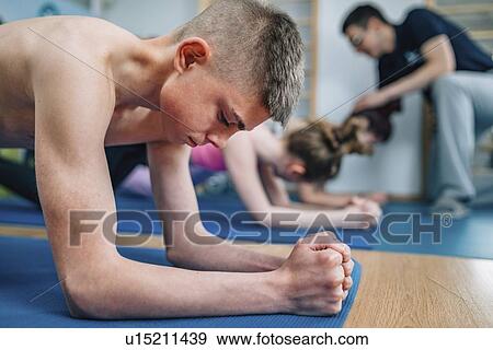 Stock Photo - Physical therapist with teenagers. Fotosearch