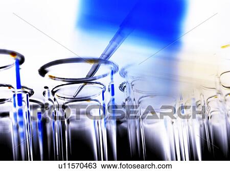 Stock Image - Pipetting sample. Fotosearch