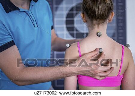 Stock Image - Placing markers for posture analysis. Fotosearch