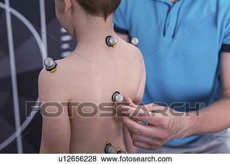 Stock Photo - Placing markers for posture analysis. Fotosearch