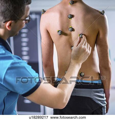 Stock Photo - Placing markers for posture analysis. Fotosearch