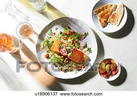 Plate of salmon and salad with pitta bread, overhead view View Large Photo Image Stock Photo - Plate of salmon and salad with pitta bread, overhead view. Fotosearch