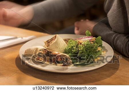 Plate of wrap sandwich ready on table View Large Photo Image Stock Image - Plate of wrap sandwich ready on table. Fotosearch