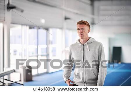 Portrait of athlete on indoor running track View Large Photo Image Stock Photo - Portrait of athlete on indoor running track. Fotosearch