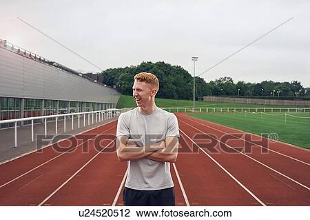 Stock Image - Portrait of athlete on running track. Fotosearch