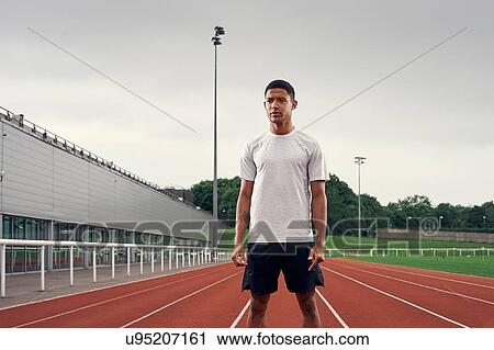 Portrait of athlete on running track View Large Photo Image Stock Image - Portrait of athlete on running track. Fotosearch