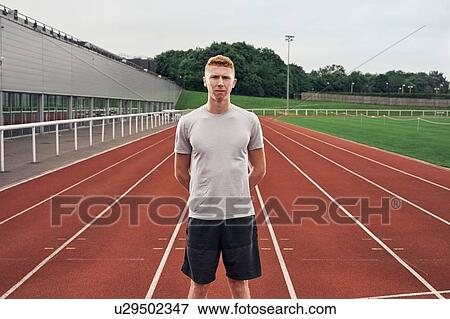 Portrait of athlete on running track View Large Photo Image Stock Photo - Portrait of athlete on running track. Fotosearch