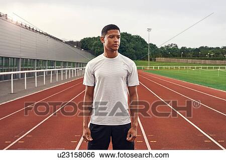Portrait of athlete on running track View Large Photo Image Stock Photograph - Portrait of athlete on running track. Fotosearch