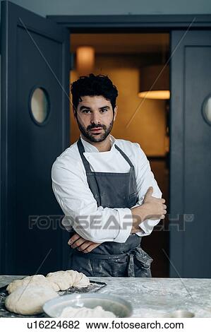 Stock Image - Portrait of chef in kitchen. Fotosearch