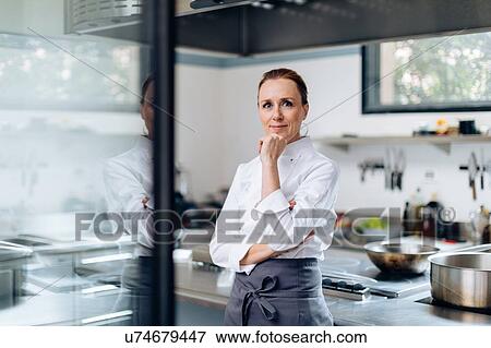 Stock Photo - Portrait of chef in kitchen. Fotosearch