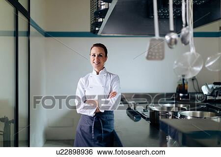 Stock Photograph - Portrait of chef in kitchen. Fotosearch