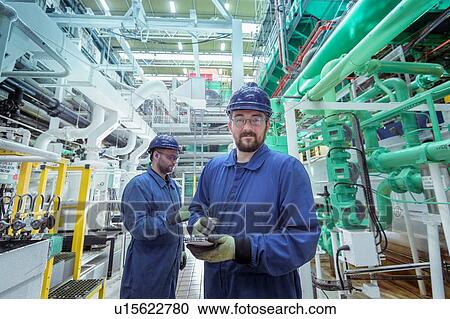 Portrait of engineer in turbine hall in nuclear power station View Large Photo Image Stock Image - Portrait of engineer in turbine hall in nuclear power station. Fotosearch
