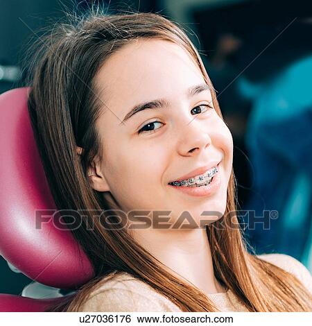 Stock Photograph - Portrait of girl with dental braces.. Fotosearch