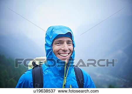 Stock Photo - Portrait of hiker in wet conditions, Mont Cervin, Matterhorn, Valais, Switzerland. Fotosearch