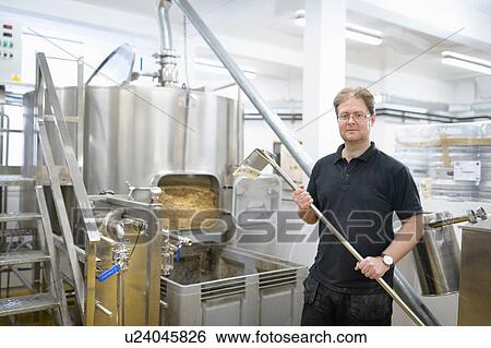 Stock Photograph - Portrait of master brewer in small brewery. Fotosearch