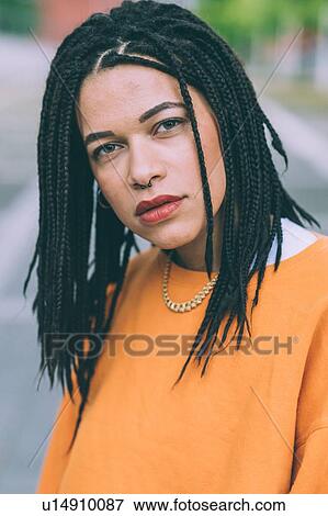 Stock Photo - Portrait of woman with braided hairstyle. Fotosearch