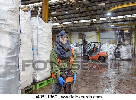 Portrait of worker in vehicle battery recycling plant View Large Photo Image Stock Image - Portrait of worker in vehicle battery recycling plant. Fotosearch