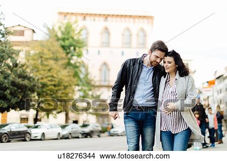 Picture - Pregnant couple walking, Florence, Italy. Fotosearch