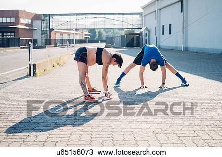 Pregnant woman and personal trainer working out outdoors View Large Photo Image Stock Image - Pregnant woman and personal trainer working out outdoors. Fotosearch