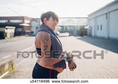 Pregnant woman taking break from workout View Large Photo Image Stock Photo - Pregnant woman taking break from workout. Fotosearch