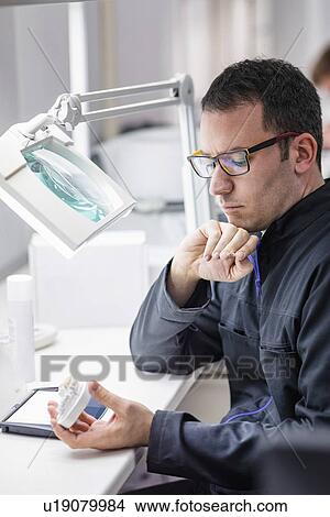 Picture - Prosthetic dentistry technician at work. Fotosearch
