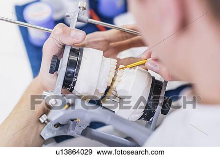 Stock Photo - Prosthetic dentistry technician at work. Fotosearch