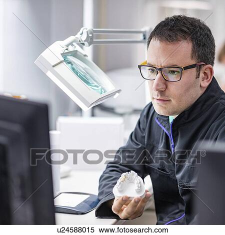 Stock Photography - Prosthetic dentistry technician at work. Fotosearch