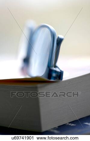 Reading glasses on book View Large Photo Image Stock Image - Reading glasses on book. Fotosearch