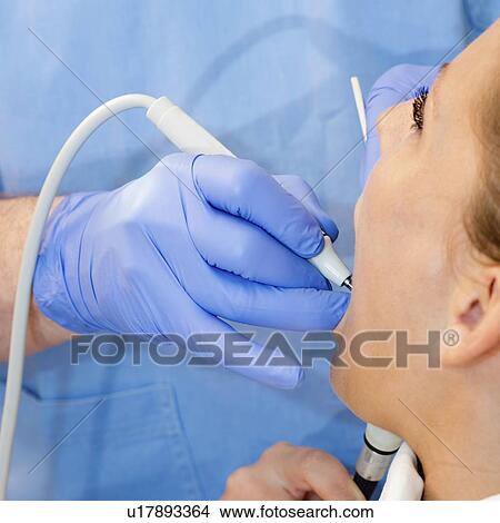 Picture - Removing dental tartar. Fotosearch