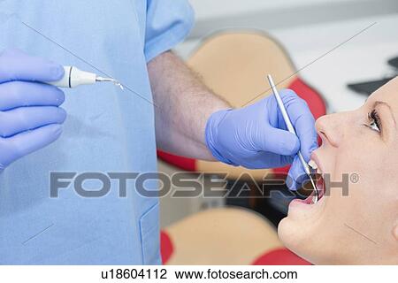 Removing dental tartar View Large Photo Image Stock Image - Removing dental tartar. Fotosearch