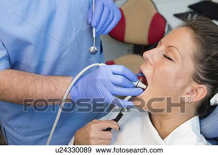 Removing dental tartar View Large Photo Image Stock Photo - Removing dental tartar. Fotosearch