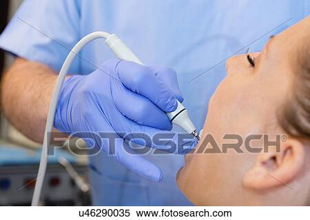 Removing dental tartar View Large Photo Image Stock Photography - Removing dental tartar. Fotosearch