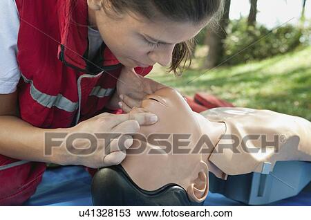 Rescue breaths on CPR dummy View Large Photo Image Stock Image - Rescue breaths on CPR dummy. Fotosearch
