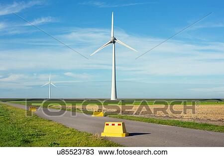 Road block near modern wind turbines on and offshore, Creil, Flevoland, Netherlands View Large Photo Image Stock Image - Road block near modern wind turbines on and offshore, Creil, Flevoland, Netherlands. Fotosearch