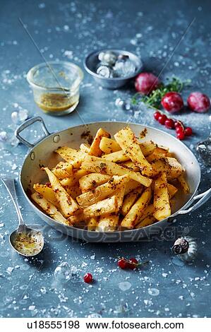 Roast parsnips in skillet, Christmas food View Large Photo Image Stock Photo - Roast parsnips in skillet, Christmas food. Fotosearch