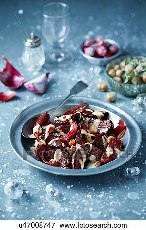 Roasted beetroot in bowl with hazelnut salad, seasonal Christmas food View Large Photo Image Stock Photo - Roasted beetroot in bowl with hazelnut salad, seasonal Christmas food. Fotosearch