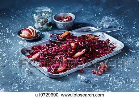 Stock Image - Roasted red cabbage and sliced apple in baking tin, seasonal Christmas food. Fotosearch