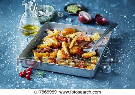 Roasted vegetables with red onions in roasting tin, seasonal christmas food View Large Photo Image Stock Photo - Roasted vegetables with red onions in roasting tin, seasonal christmas food. Fotosearch