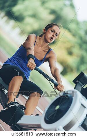 Stock Image - Rowing machine competition. Fotosearch