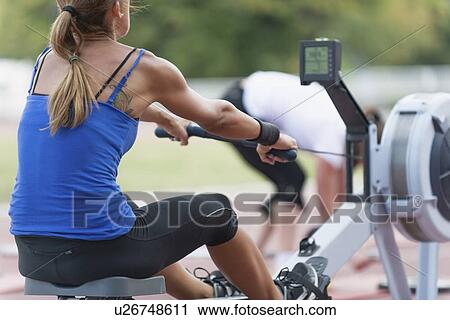 Stock Image - Rowing machine competition. Fotosearch