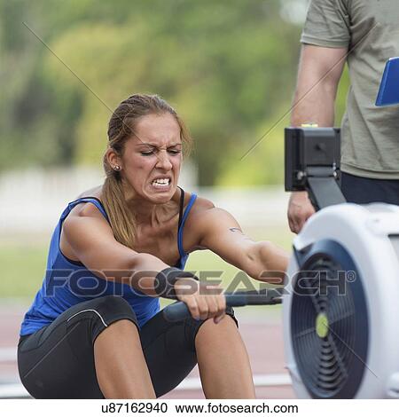 Stock Image - Rowing machine competition. Fotosearch