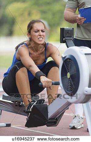 Stock Photo - Rowing machine competition. Fotosearch