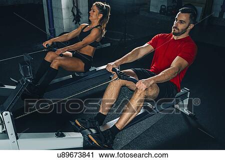 Stock Image - Rowing machine workout. Fotosearch