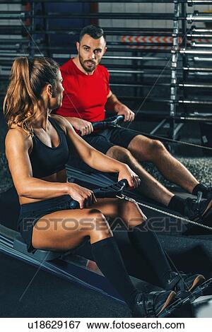 Stock Photo - Rowing machine workout. Fotosearch