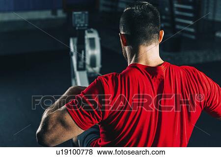 Rowing machine workout View Large Photo Image Stock Photo - Rowing machine workout. Fotosearch