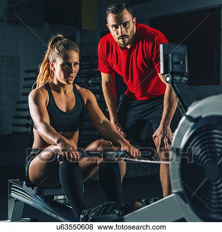 Stock Photo - Rowing machine workout. Fotosearch